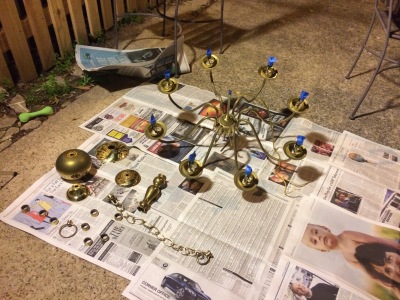 Disassembled tacky brass chandelier